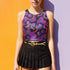 Honey Dazed Brand body-hugging racerback crop top featuring Y2K-inspired print with purple gradient cherries, holographic bows, and swirling patterns in pink, purple, and blue on black background in performance knit fabric